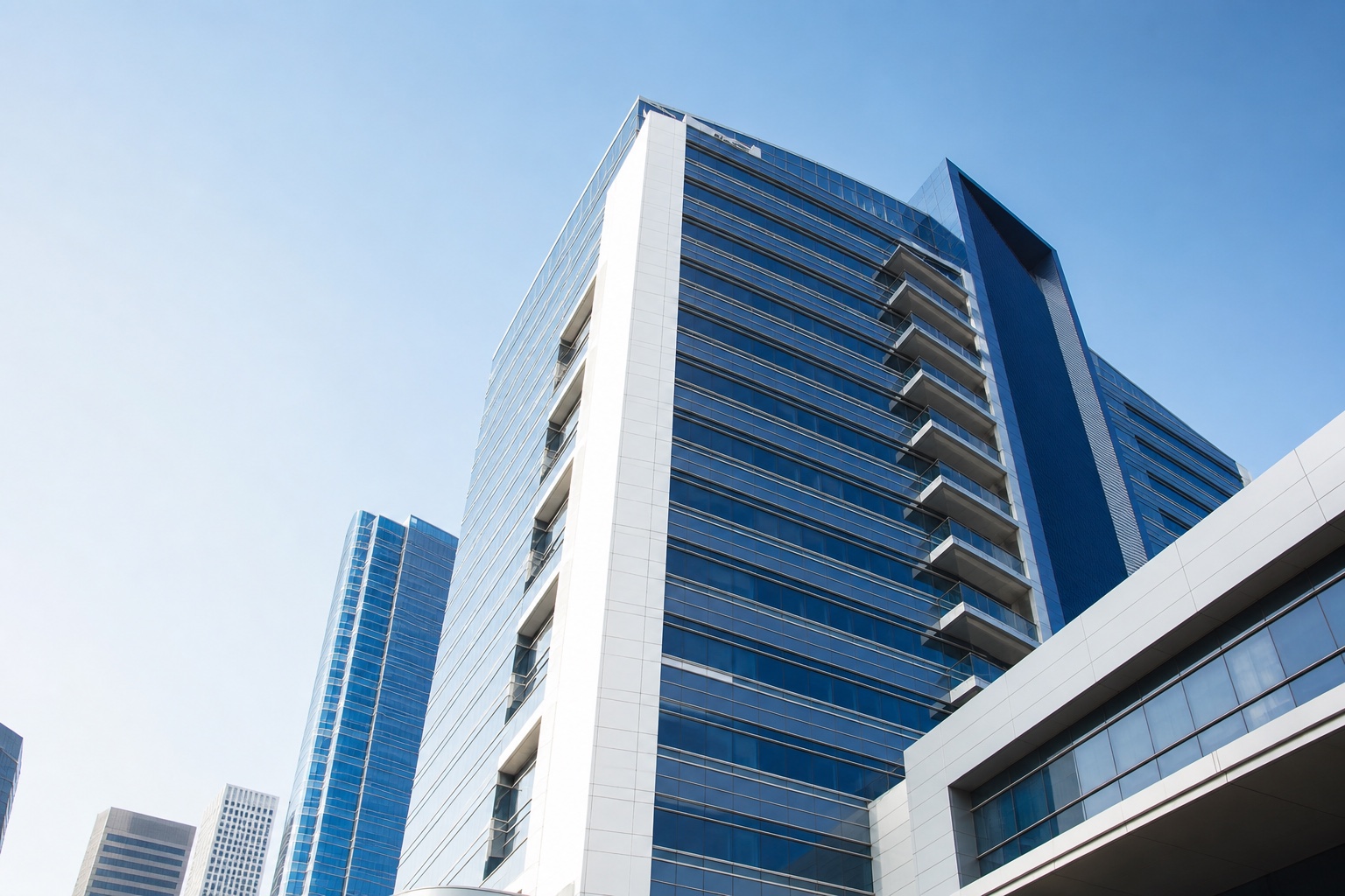 Contemporary Houston office tower with white, glass and blue architectural surfaces