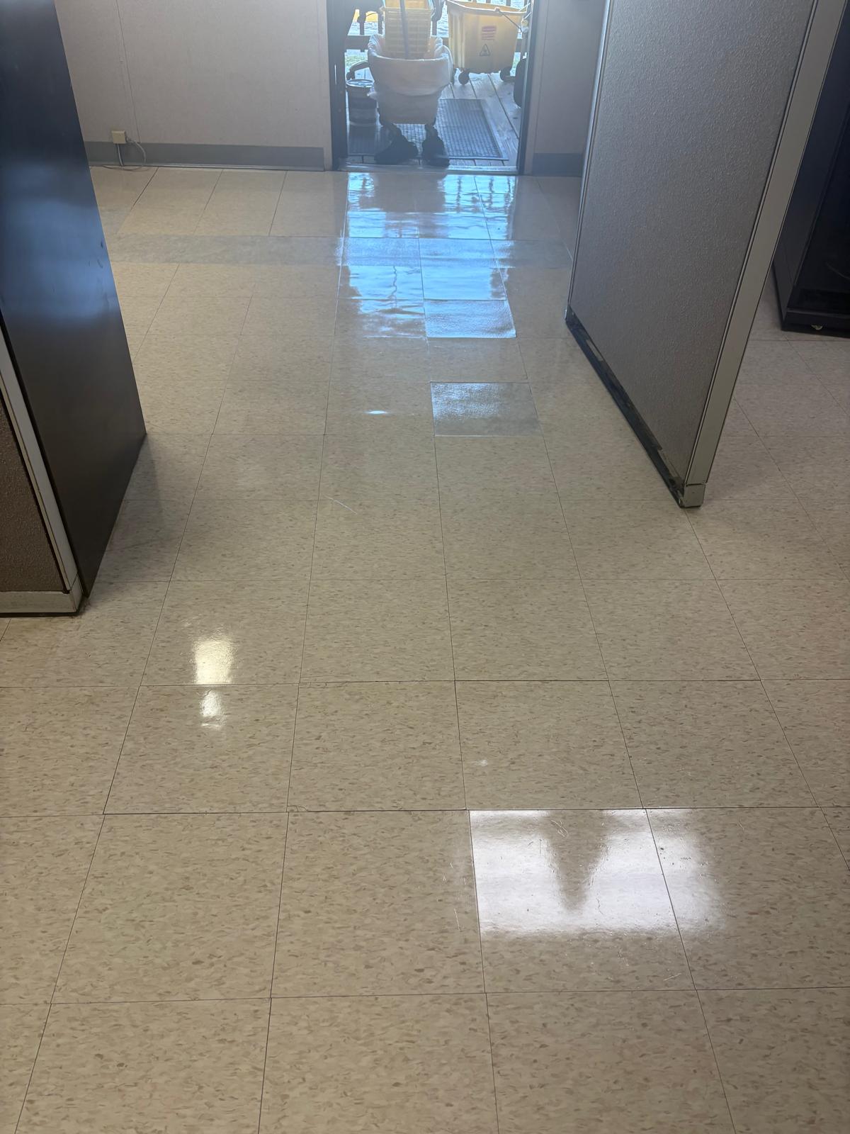 Clean, glossy office corridor floor maintained by MCS Solutions