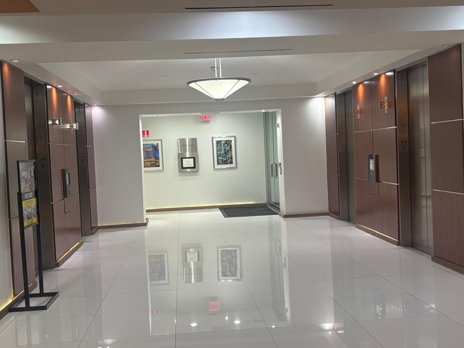 Polished marble elevator lobby floor in a Houston commercial building